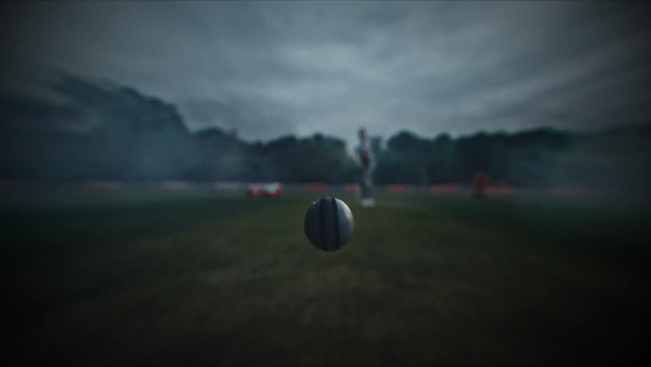 A black and white photo of a soccer ball in the air. Description generated by AI